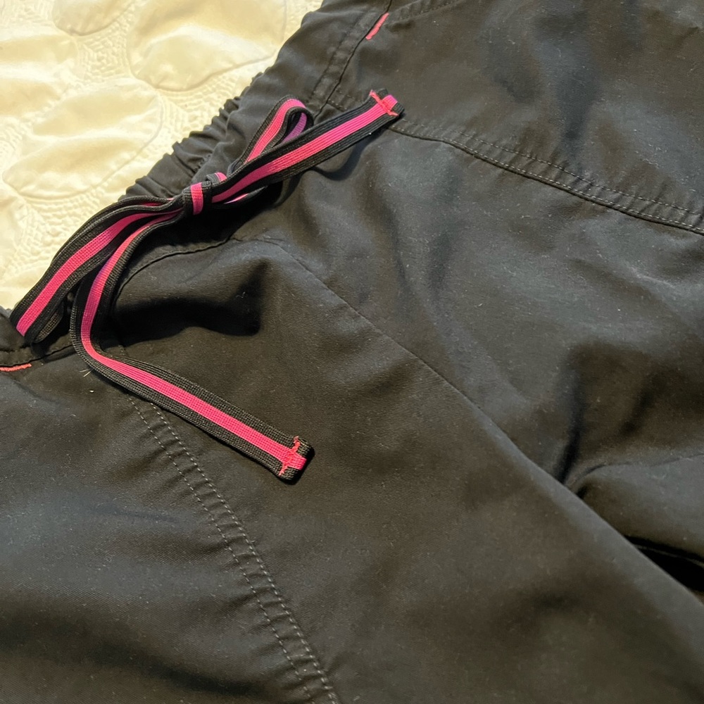 Black scrub top and bottom with pink detail